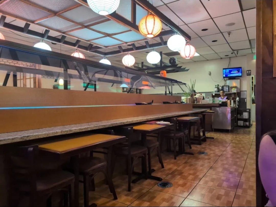 Inside King & I — paper lanterns over the sushi bar counter