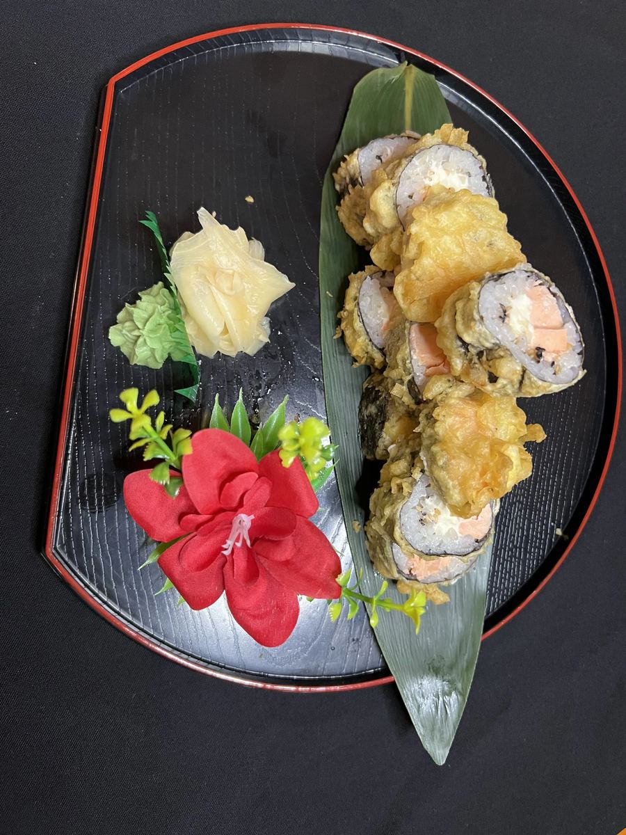 Salmon roll on a bamboo leaf
