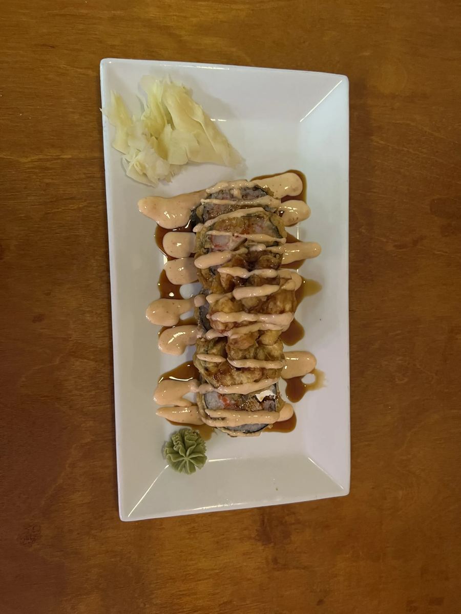 Salmon and tuna avocado rolls plated side by side